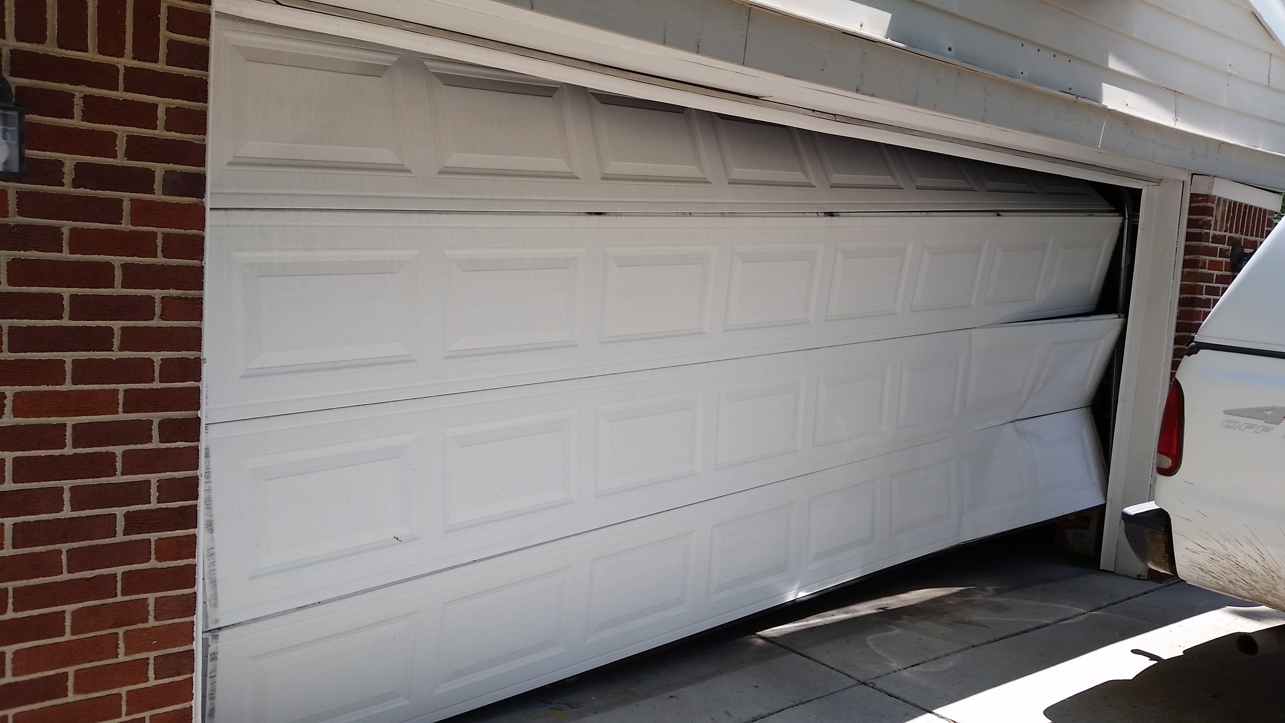 NJ Garage Door Problems: When to Repair a Bent Track vs. Replace It Entirely